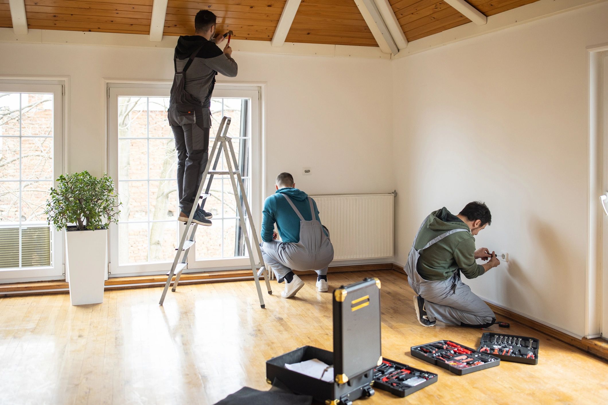 Professionals completing interior ceiling installation work